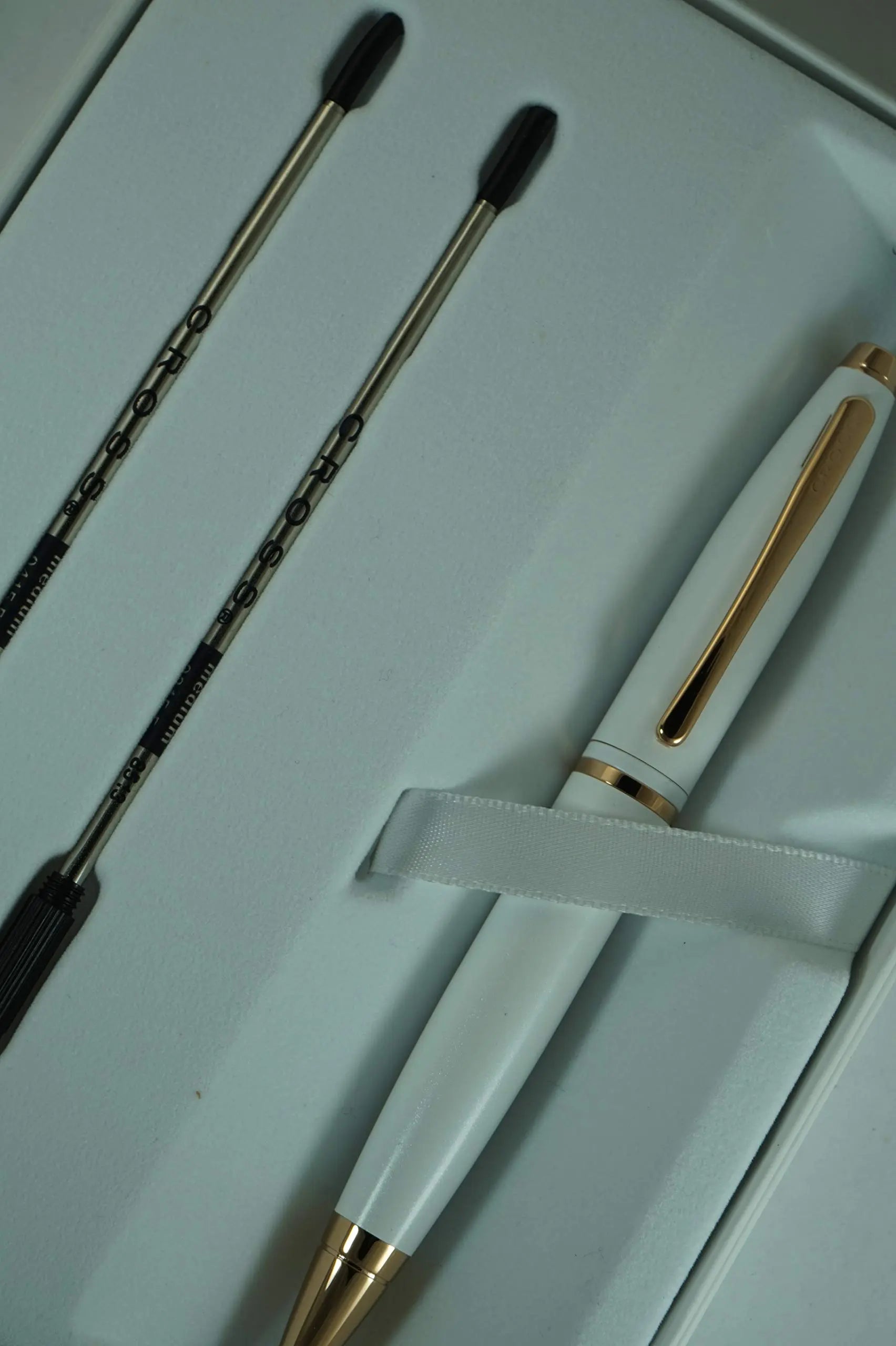 A.T. Cross Pearlescent White Medalist and 23KT Rose Gold Appointments and Cross signature mid Band Calaise Ballpoint Pen and two Bonus refills . A Gift Pen for Anyone and Any Occasion - crosspenmall.com