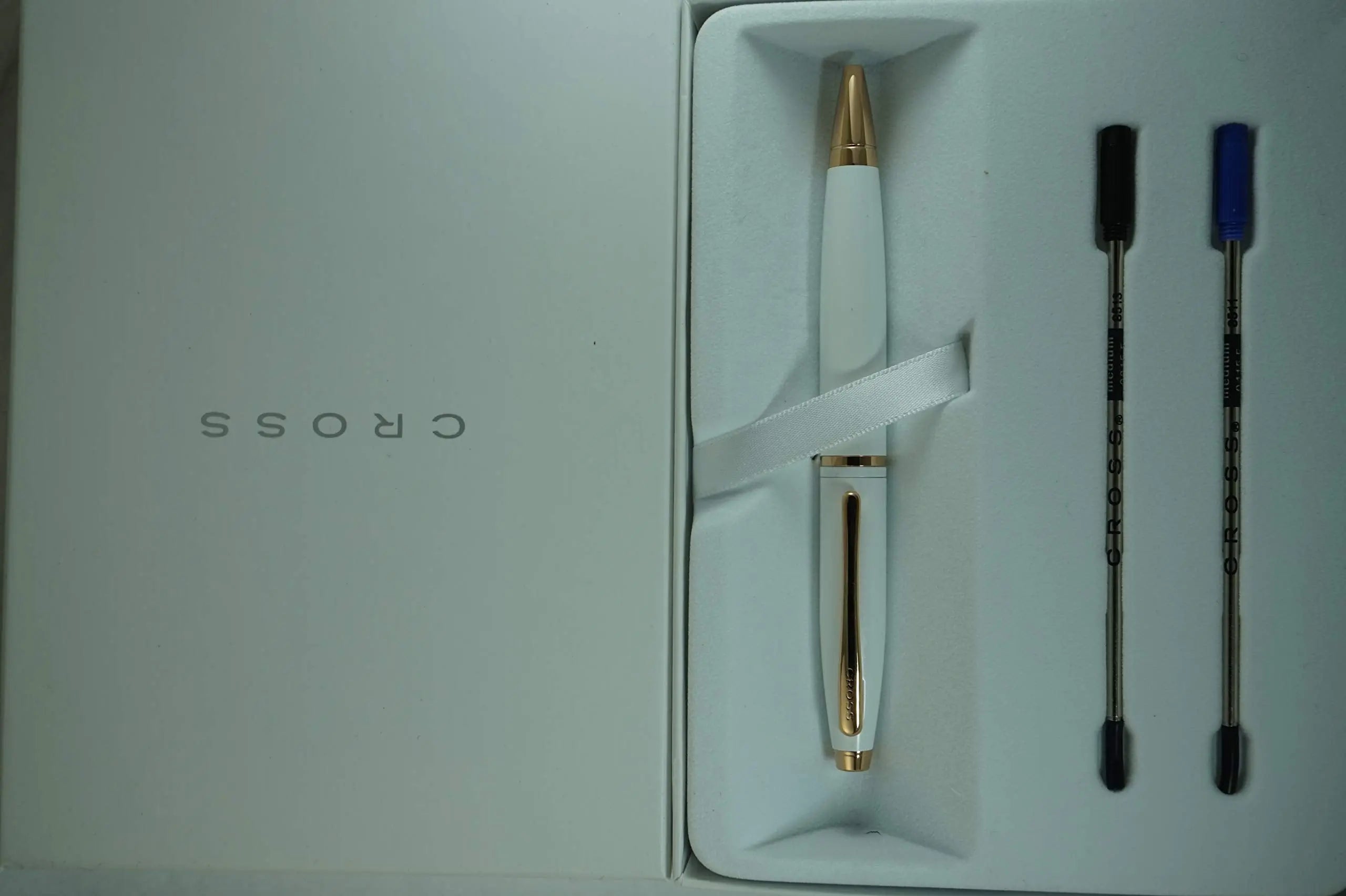 A.T. Cross Pearlescent White Medalist and 23KT Rose Gold Appointments and Cross signature mid Band Calaise Ballpoint Pen and two Bonus refills . A Gift Pen for Anyone and Any Occasion - crosspenmall.com