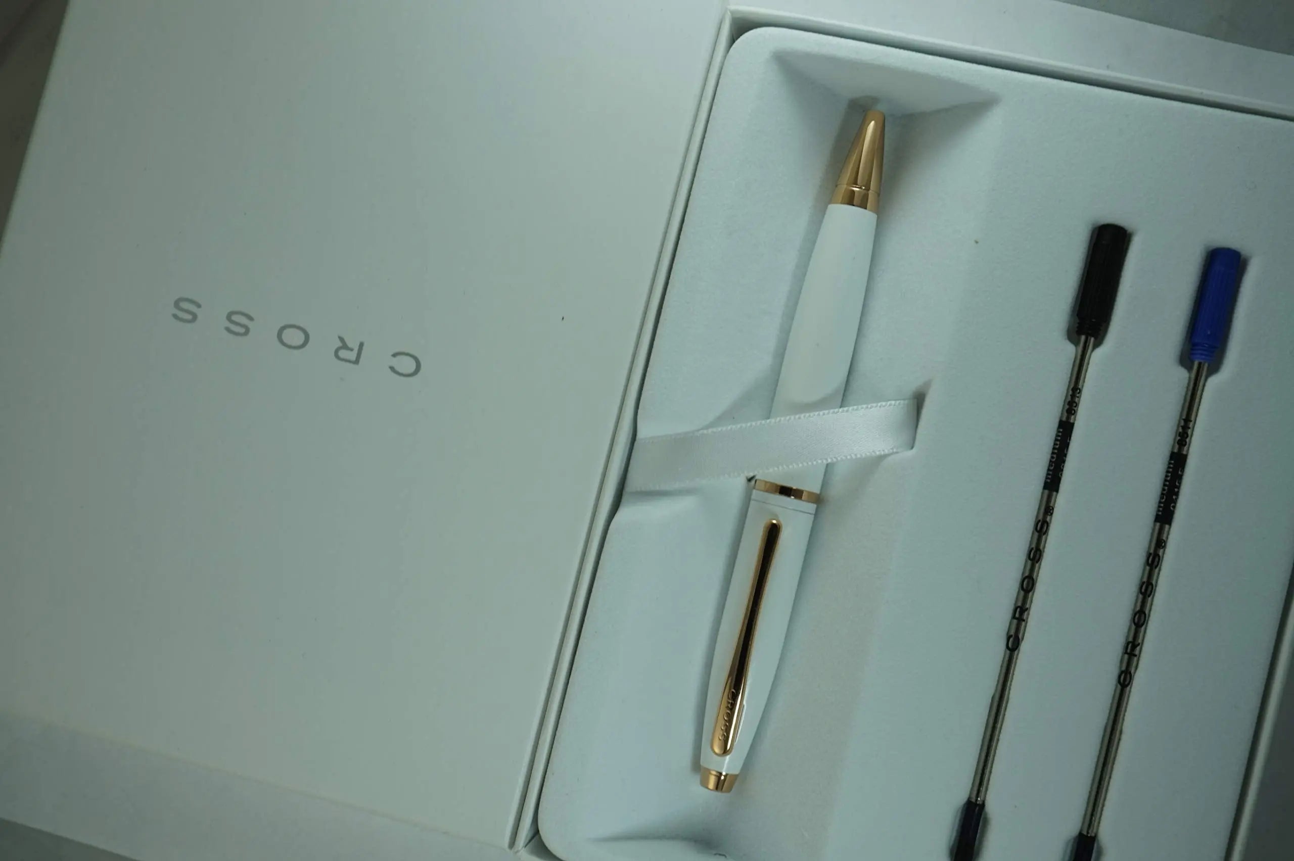 A.T. Cross Pearlescent White Medalist and 23KT Rose Gold Appointments and Cross signature mid Band Calaise Ballpoint Pen and two Bonus refills . A Gift Pen for Anyone and Any Occasion - crosspenmall.com