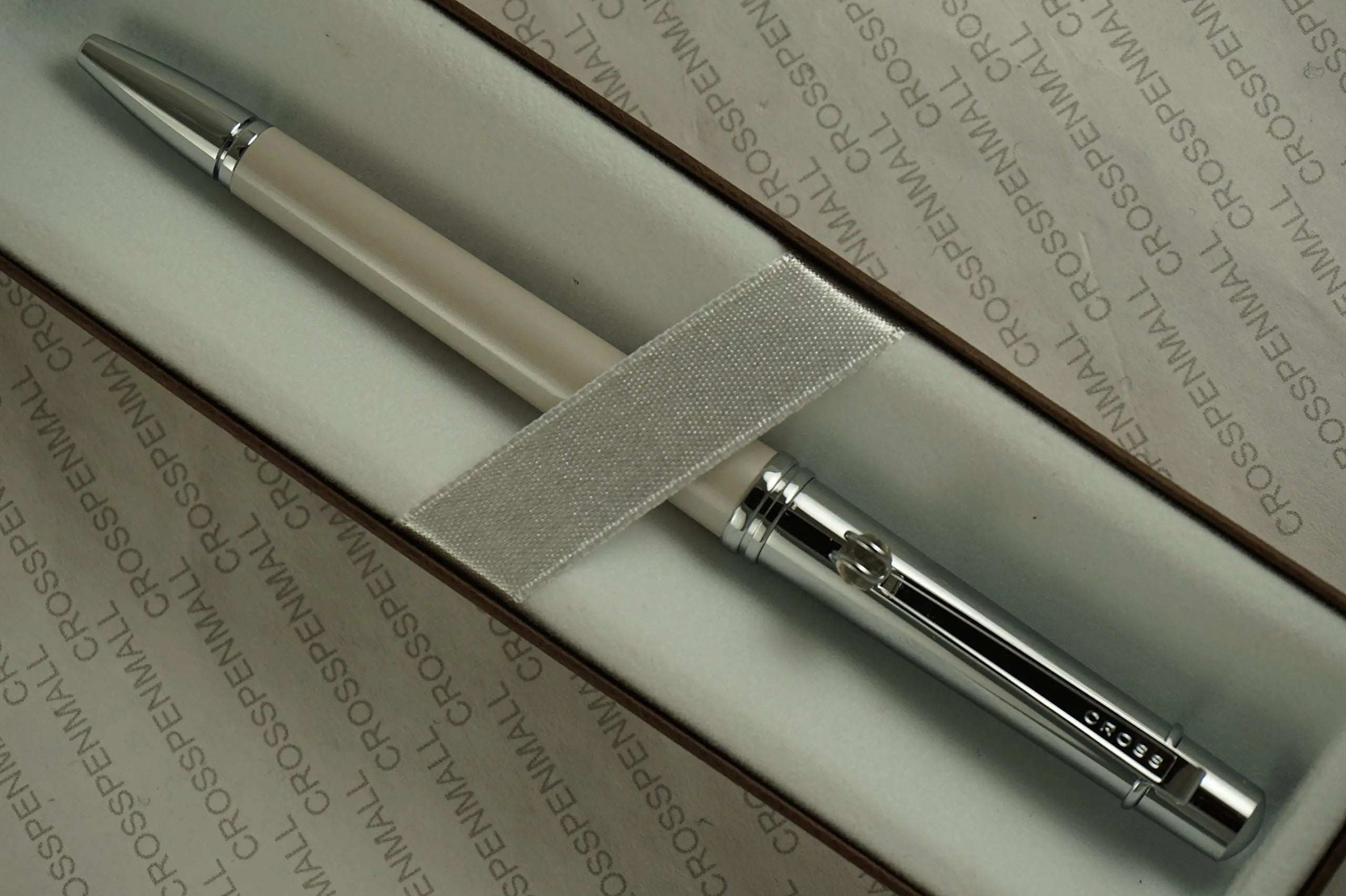 Cross Elite Stylist Ball Point Writing Pen with Faceted Crystal Teardrop Ball on Clip and Accented in Pearlescent Shell Ivory White Barrel and Extremely Polished Cap. Cross
