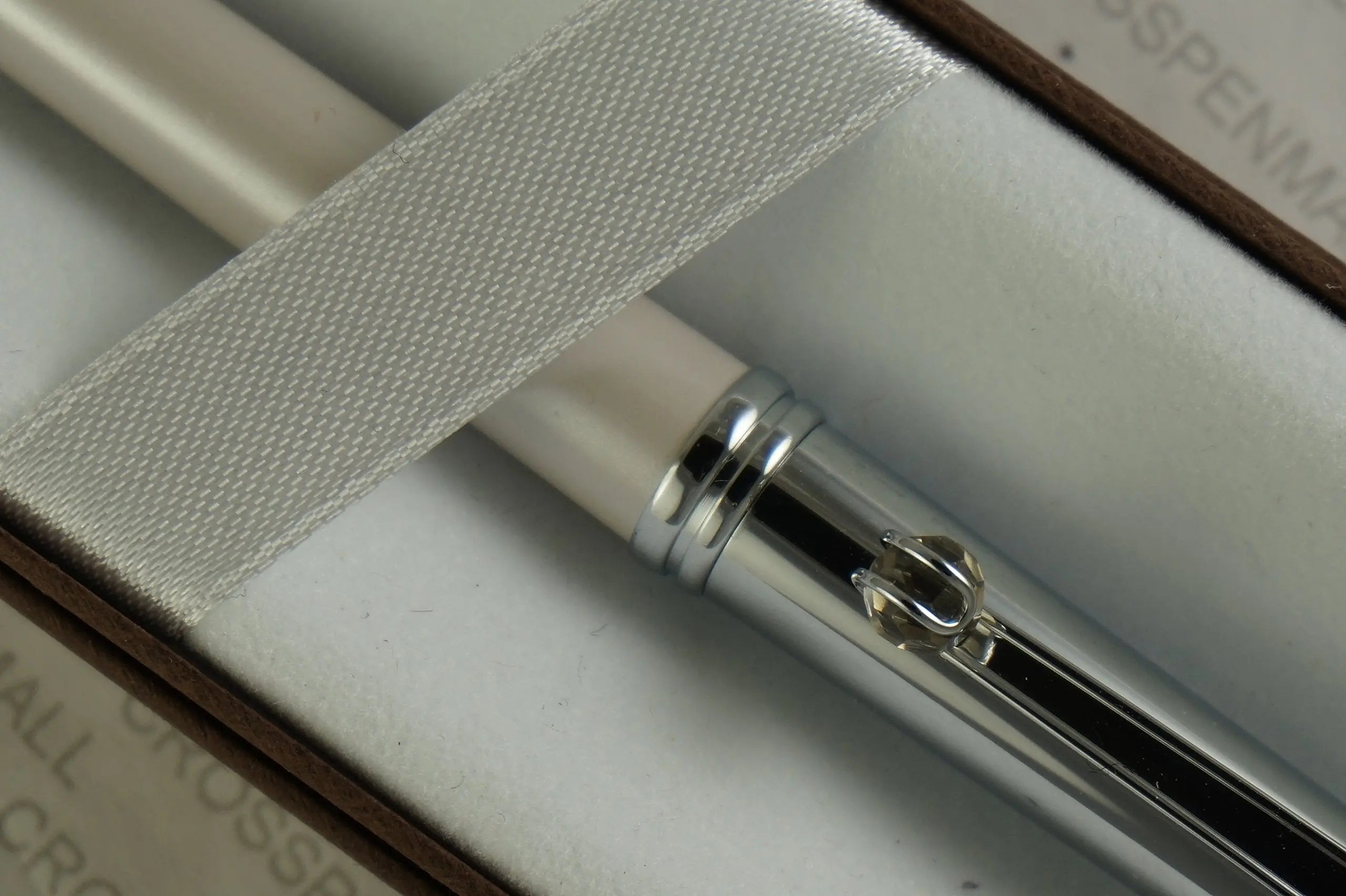 Cross Elite Stylist Ball Point Writing Pen with Faceted Crystal Teardrop Ball on Clip and Accented in Pearlescent Shell Ivory White Barrel and Extremely Polished Cap. Cross