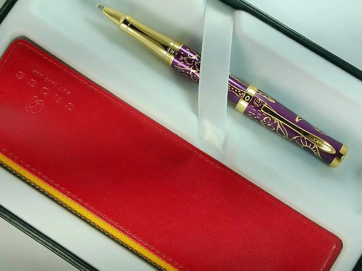 Cross Sauvage 2021 Year of the Ox Special-Edition, Hand-polished Translucent Plum lacquer finish with deep-etched Ox engraving, 23KT Gold Inlays and Appointments Selectip Rollerball Pen and Pouch cross