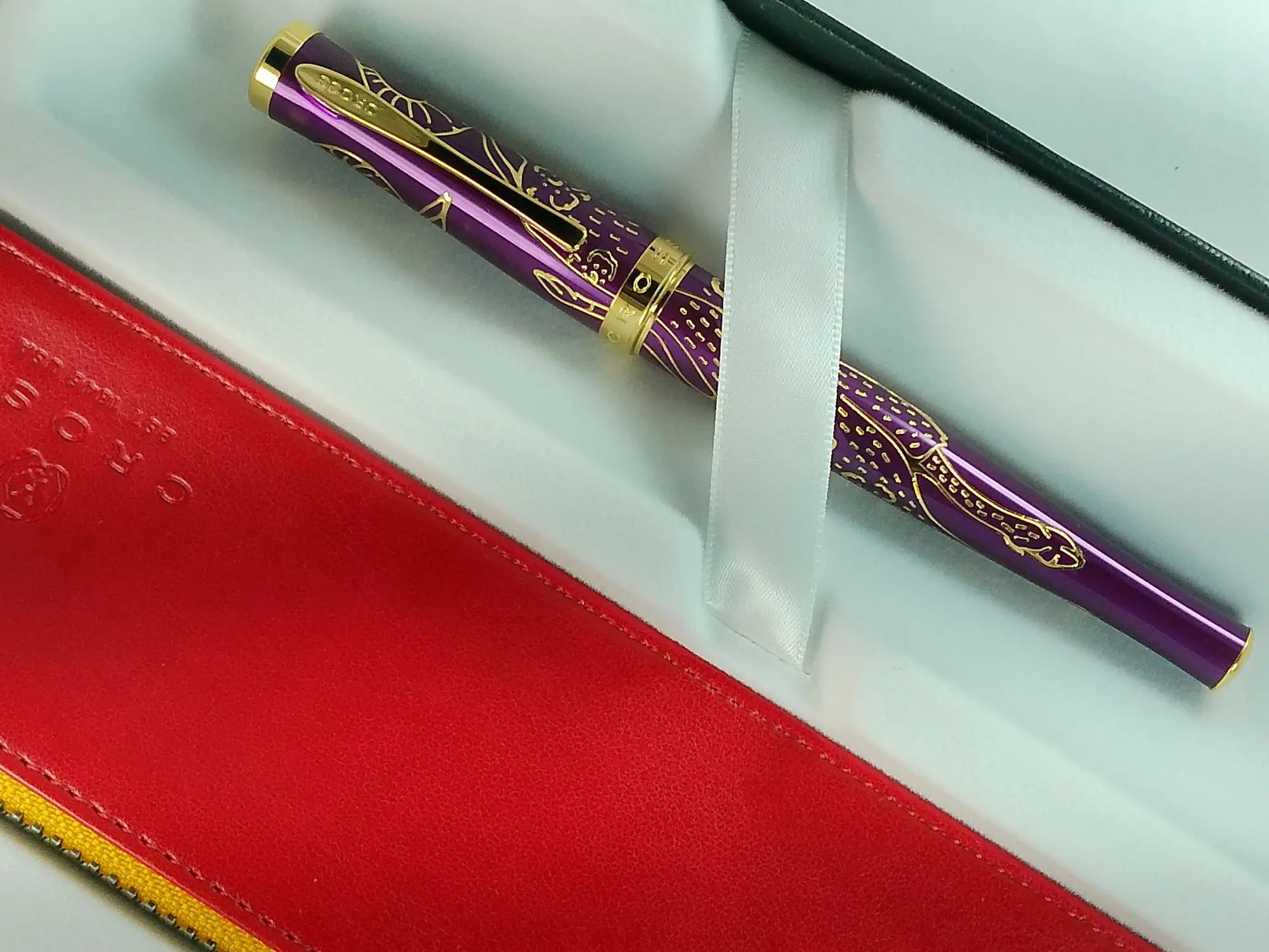 Cross Sauvage 2021 Year of the Ox Special-Edition, Hand-polished Translucent Plum lacquer finish with deep-etched ox engraving With 23KT Gold Plated Inlays and Appointments Selectip Rollerball Pen and Matching Pouch AT CROSS