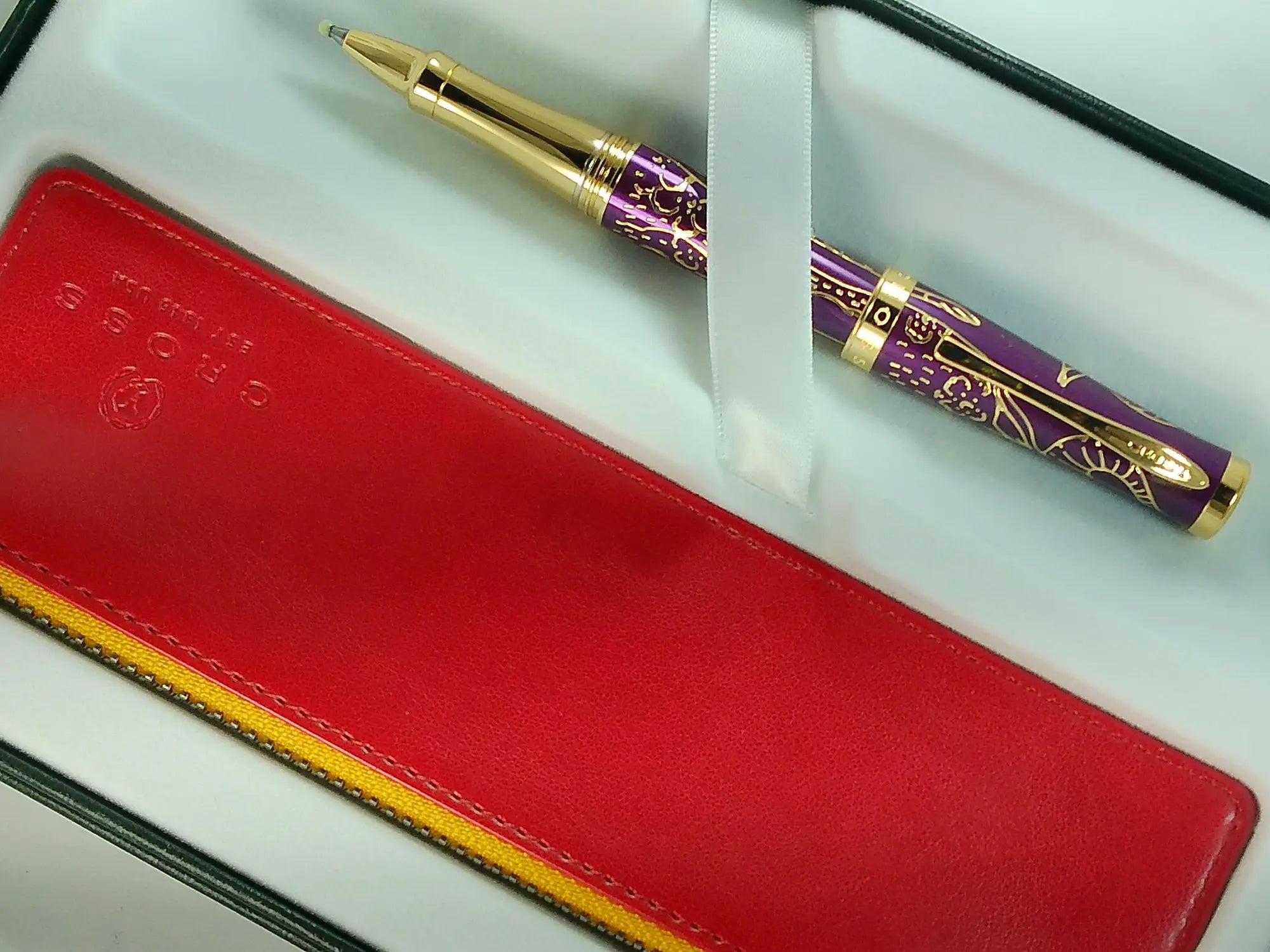 Cross Sauvage 2021 Year of the Ox Special-Edition, Hand-polished Translucent Plum lacquer finish with deep-etched ox engraving With 23KT Gold Plated Inlays and Appointments Selectip Rollerball Pen and Matching Pouch AT CROSS