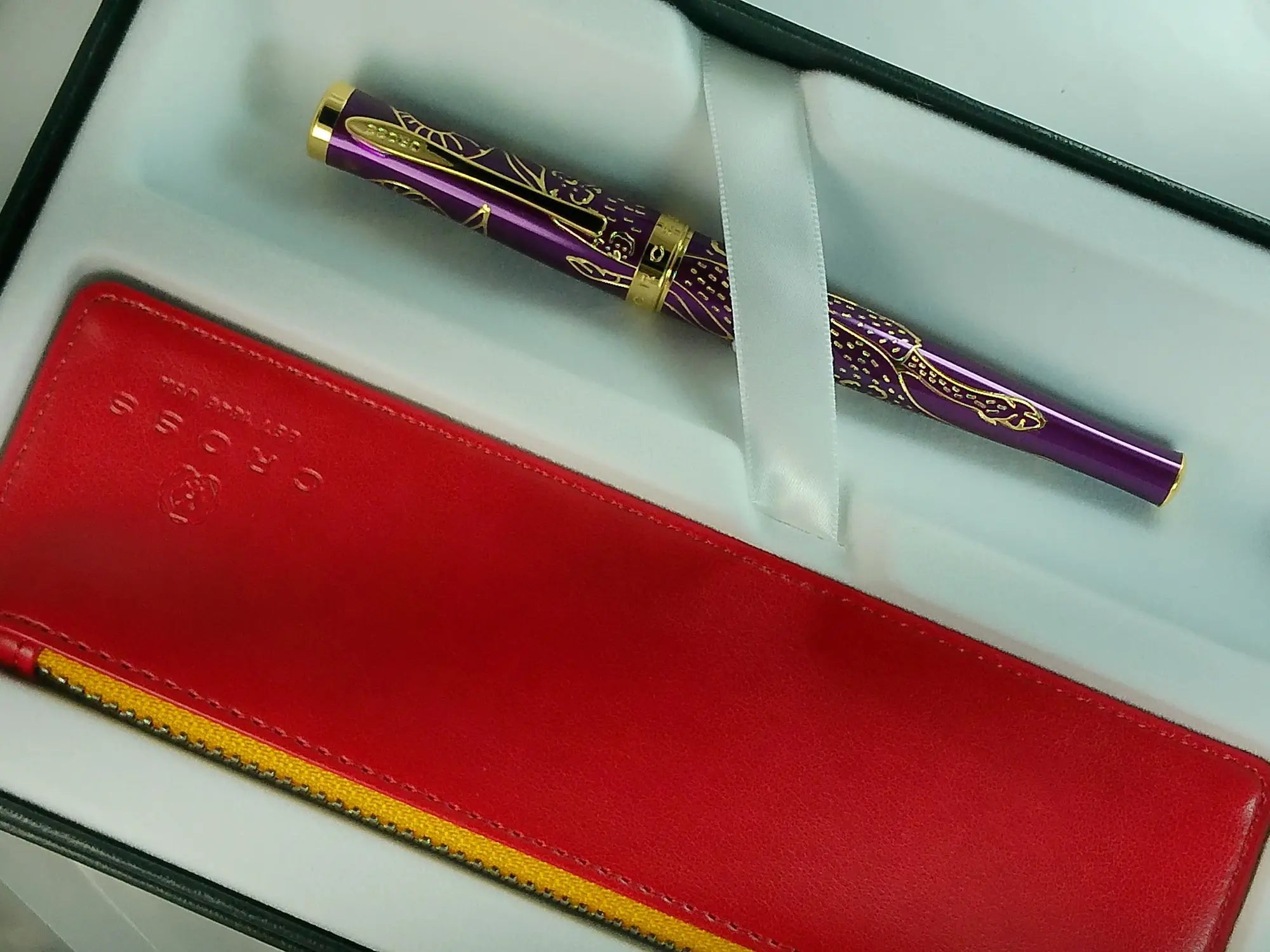 Cross Sauvage 2021 Year of the Ox Special-Edition, Hand-polished Translucent Plum lacquer finish with deep-etched ox engraving With 23KT Gold Plated Inlays and Appointments Selectip Rollerball Pen and Matching Pouch AT CROSS