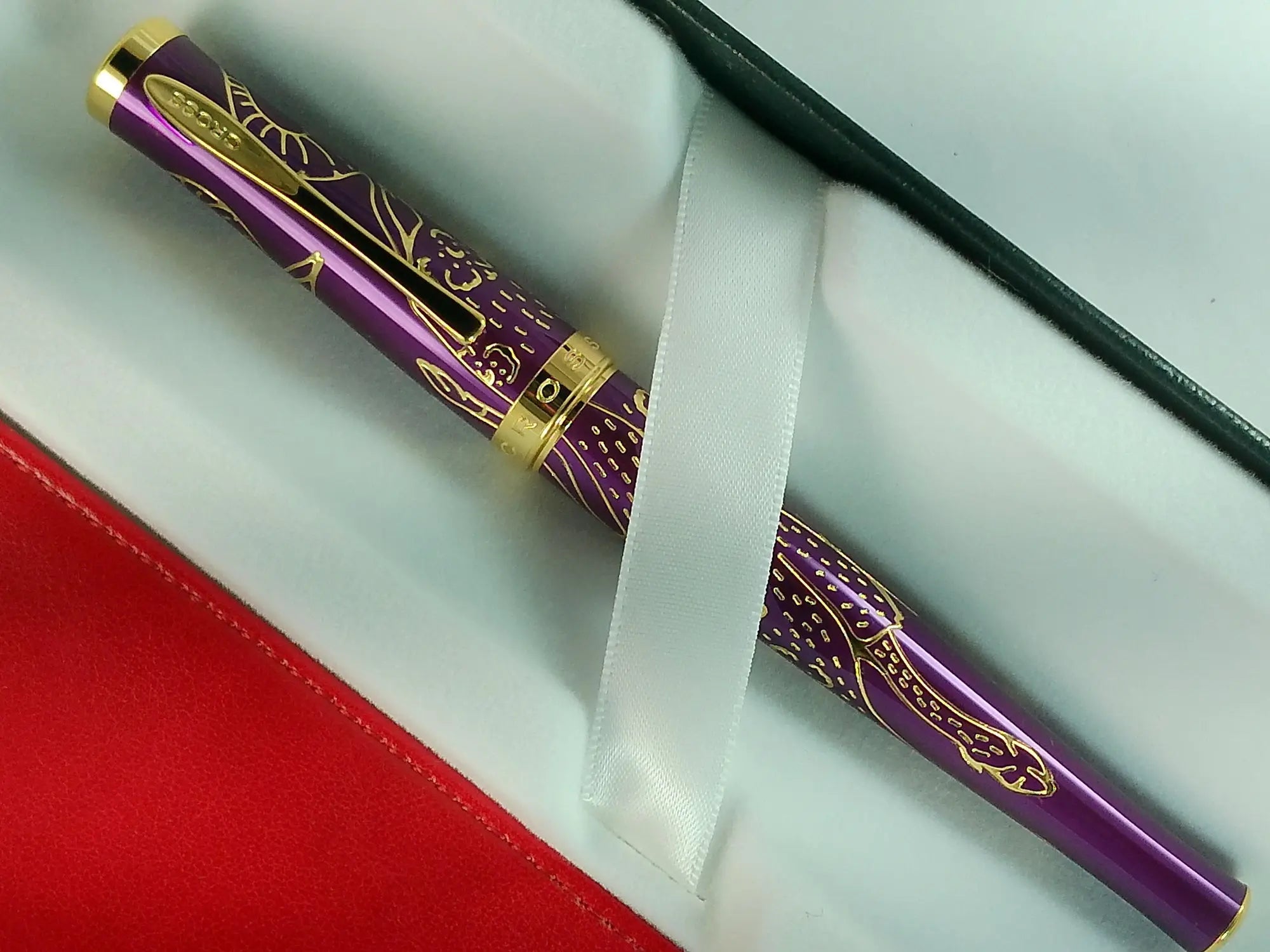 Cross Sauvage 2021 Year of the Ox Special-Edition, Hand-polished Translucent Plum lacquer finish with deep-etched ox engraving With 23KT Gold Plated Inlays and Appointments Selectip Rollerball Pen and Matching Pouch AT CROSS