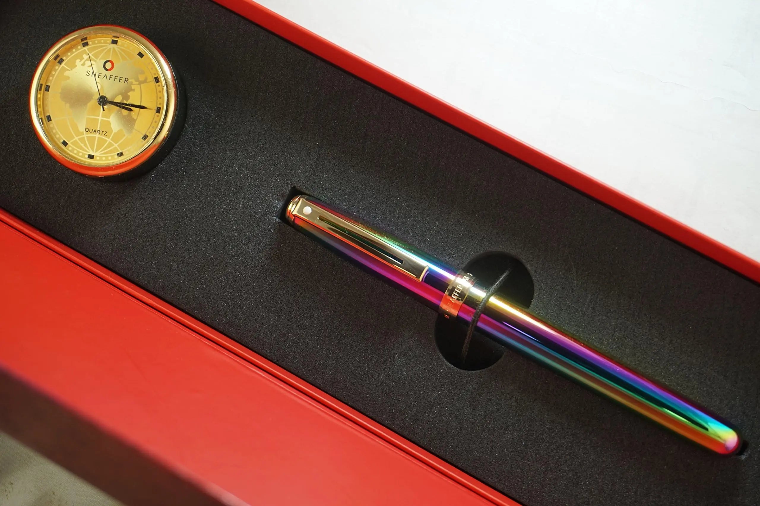 Sheaffer Made in the USA Signature Prelude Titanium oxide Rainbow 'Plasma' finish cap and barrel With 22KT Gold Appointments, Rollerball pen and Matching Gold Desk Clock Sheaffer