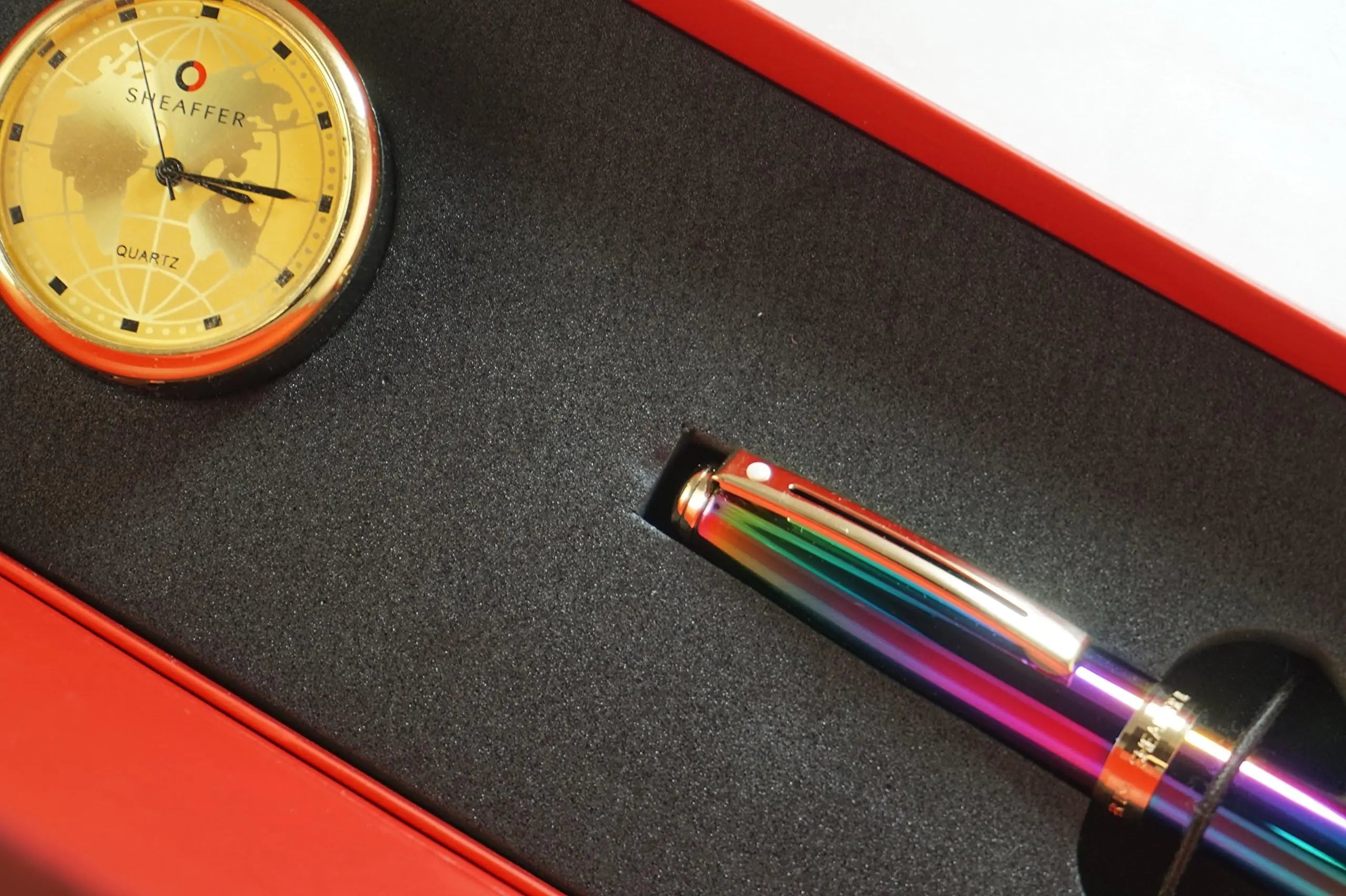 Sheaffer Made in the USA Signature Prelude Titanium oxide Rainbow 'Plasma' finish cap and barrel With 22KT Gold Appointments, Rollerball pen and Matching Gold Desk Clock Sheaffer