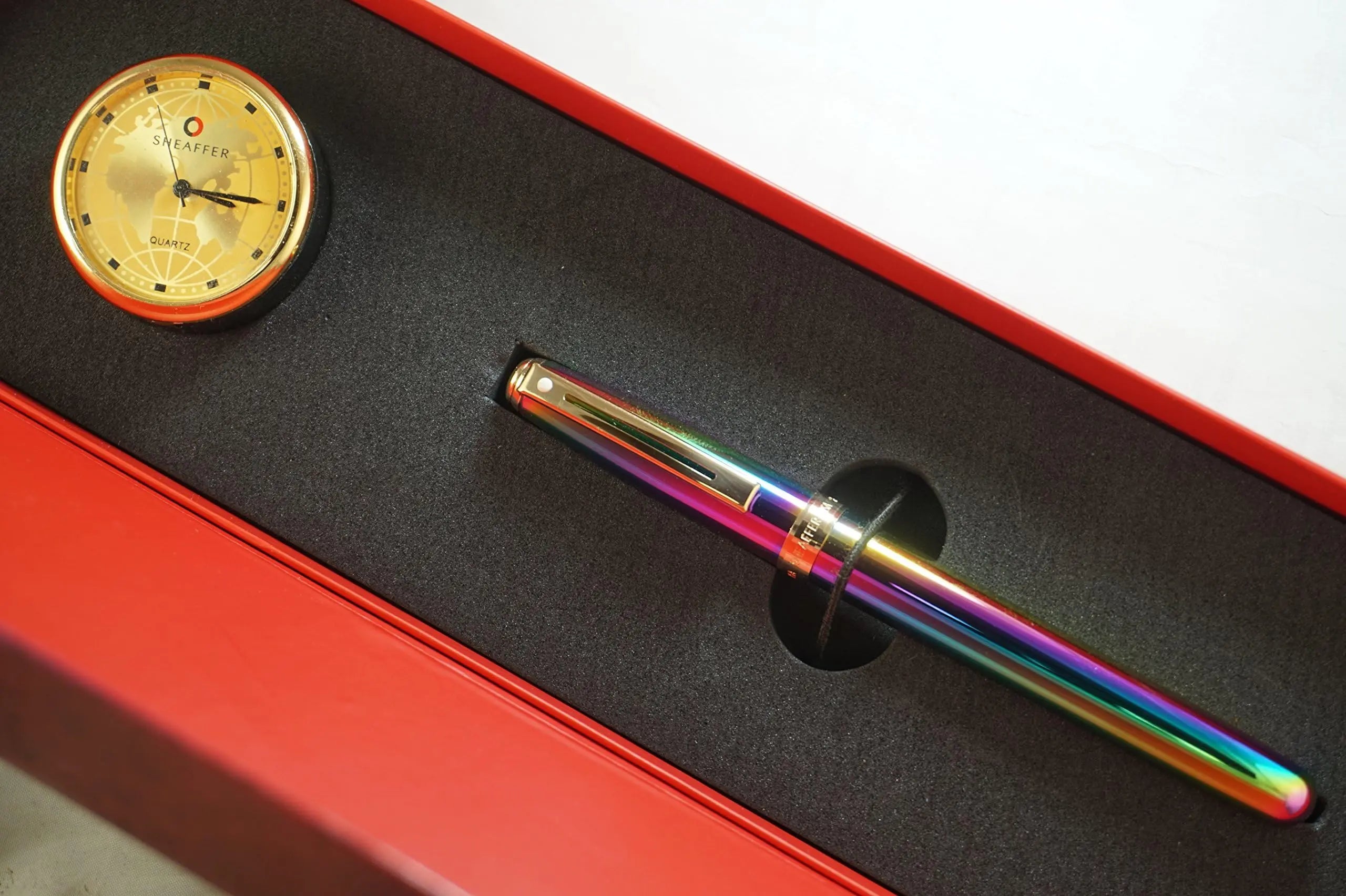 Sheaffer Made in the USA Signature Prelude Titanium oxide Rainbow 'Plasma' finish cap and barrel With 22KT Gold Appointments, Rollerball pen and Matching Gold Desk Clock Sheaffer