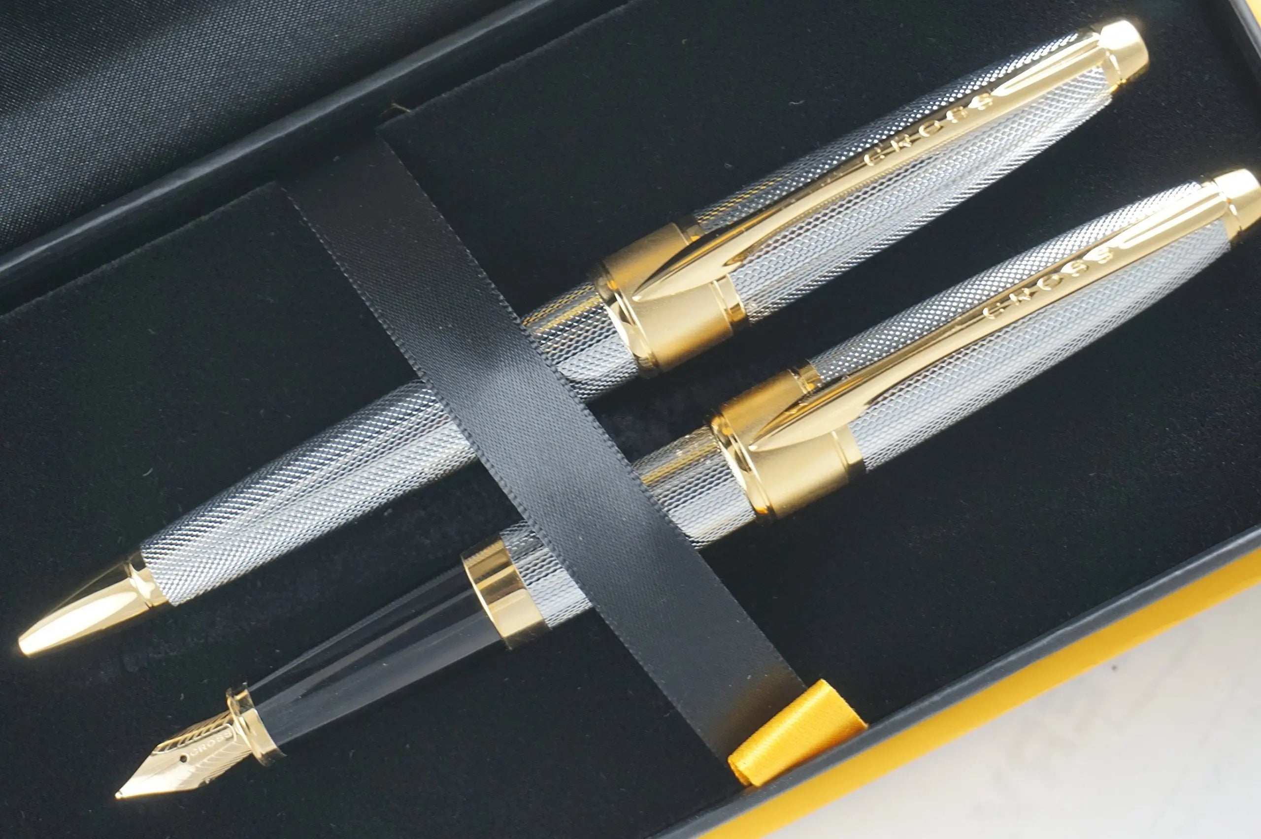Cross Limited Edition in elegant haberdashery finishes Apogee Executive Diamond Cut Elegant 23KT Gold Medalist with Solid 18KT Gold nib Fountain pen and Ballpoint Pen A great corporate gift - crosspenmall.com