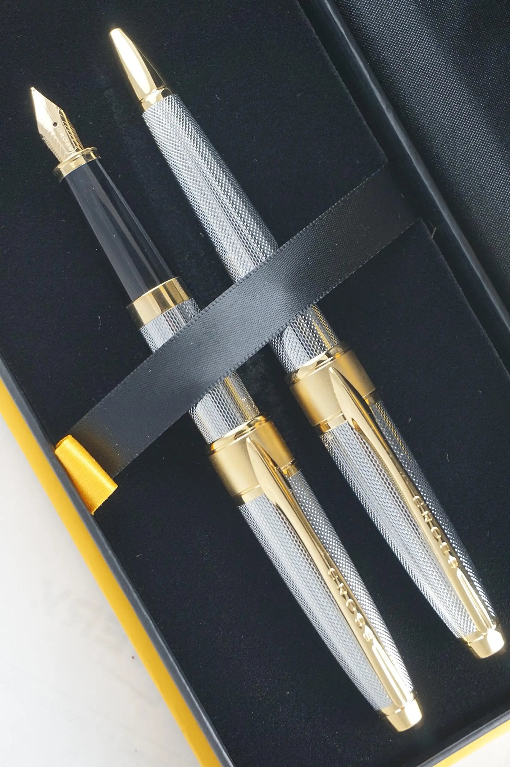Cross Limited Edition in elegant haberdashery finishes Apogee Executive Diamond Cut Elegant 23KT Gold Medalist with Solid 18KT Gold nib Fountain pen and Ballpoint Pen A great corporate gift - crosspenmall.com