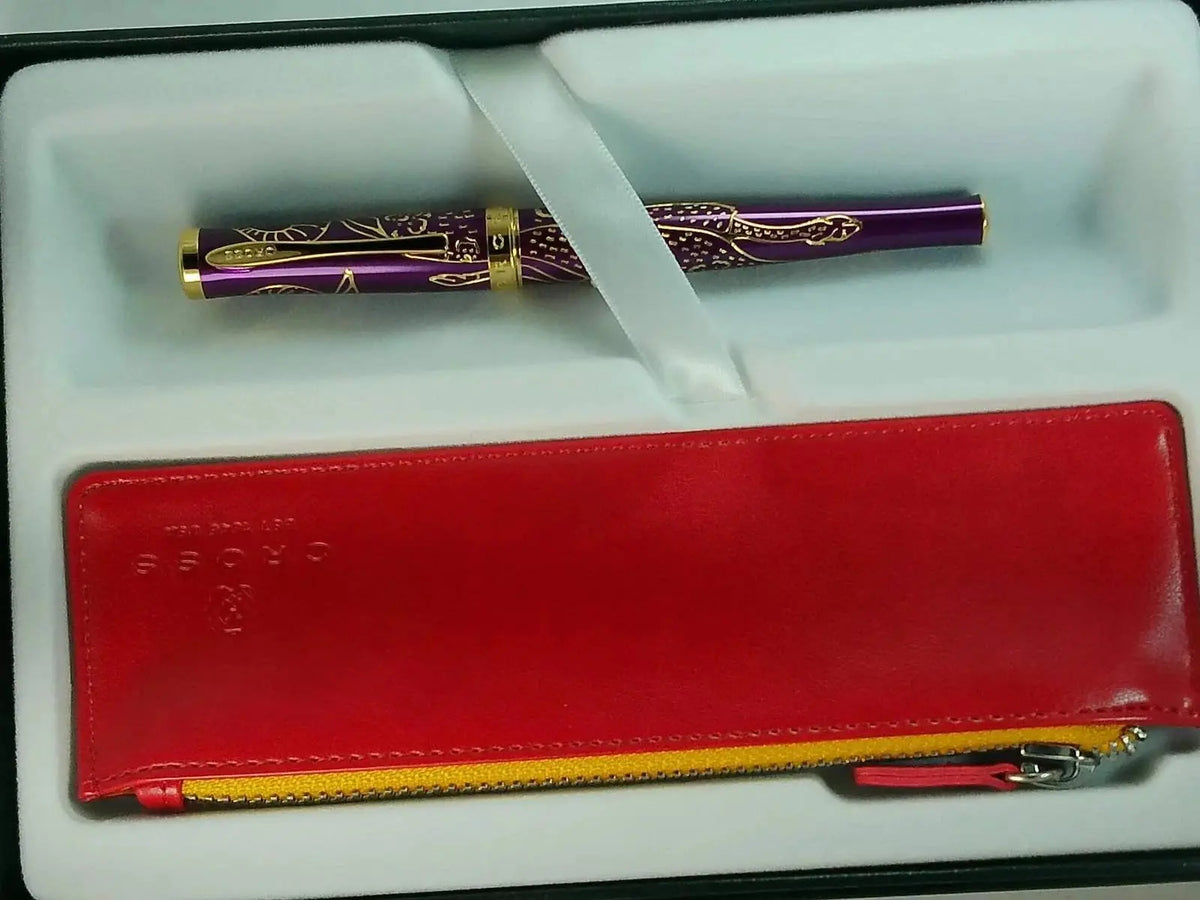 Cross Sauvage 2021 Year of the Ox Special-Edition, Hand-polished Translucent Plum lacquer finish with deep-etched Ox engraving, 23KT Gold Inlays and Appointments Selectip Rollerball Pen and Pouch cross