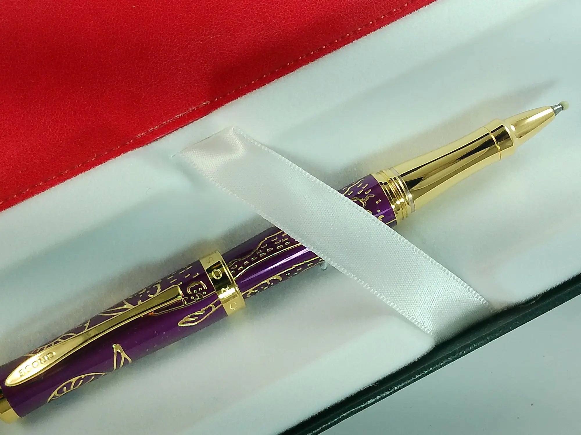 Cross Sauvage 2021 Year of the Ox Special-Edition, Hand-polished Translucent Plum lacquer finish with deep-etched ox engraving With 23KT Gold Plated Inlays and Appointments Selectip Rollerball Pen and Matching Pouch AT CROSS