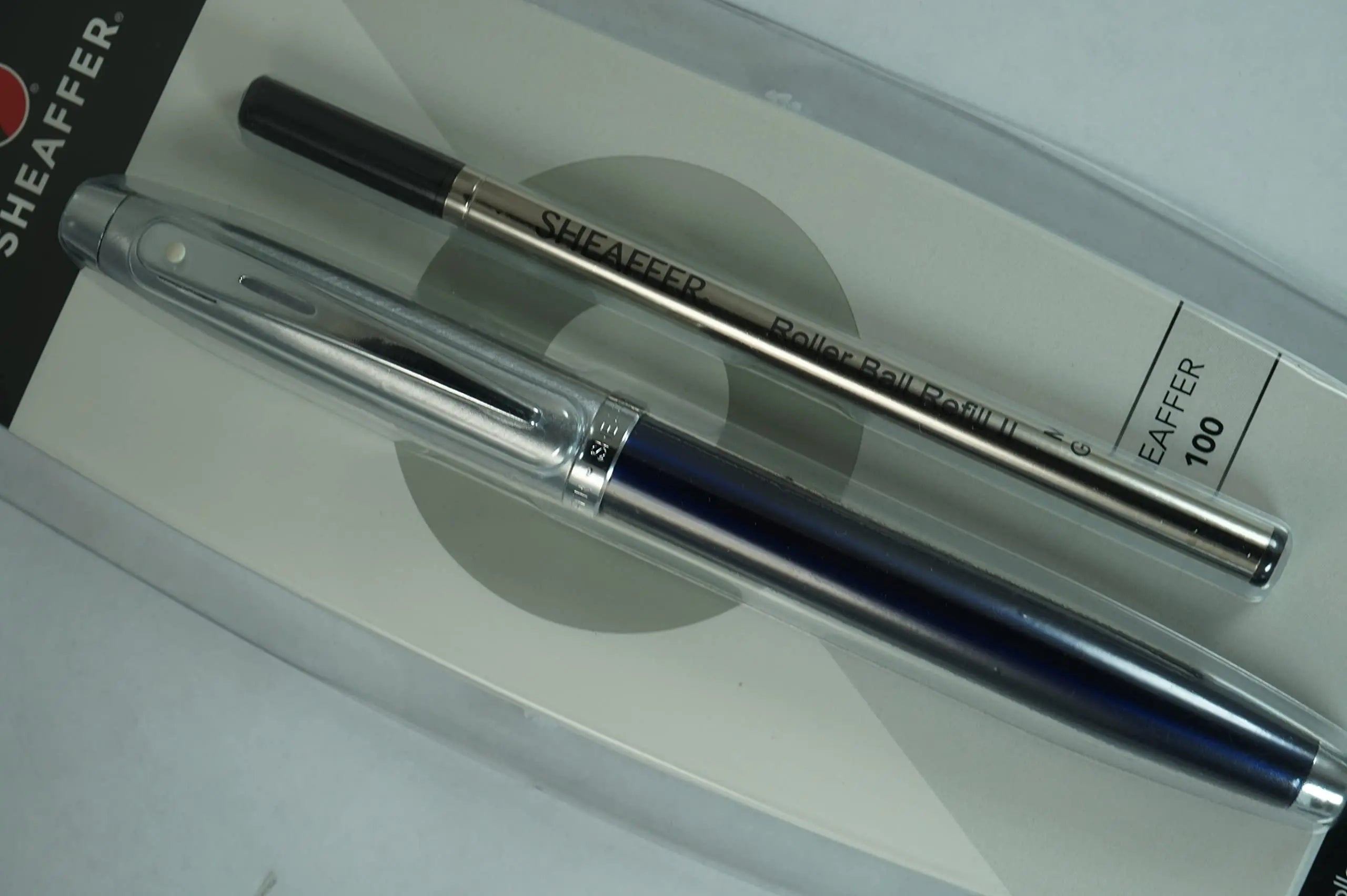 Sheaffer 100 Pearlescent Metallic Blue with Nickel appointments Signature Mid Band and Dot of excellence, Medium Point Rollerball Pen. Very solid and Responsive - crosspenmall.com