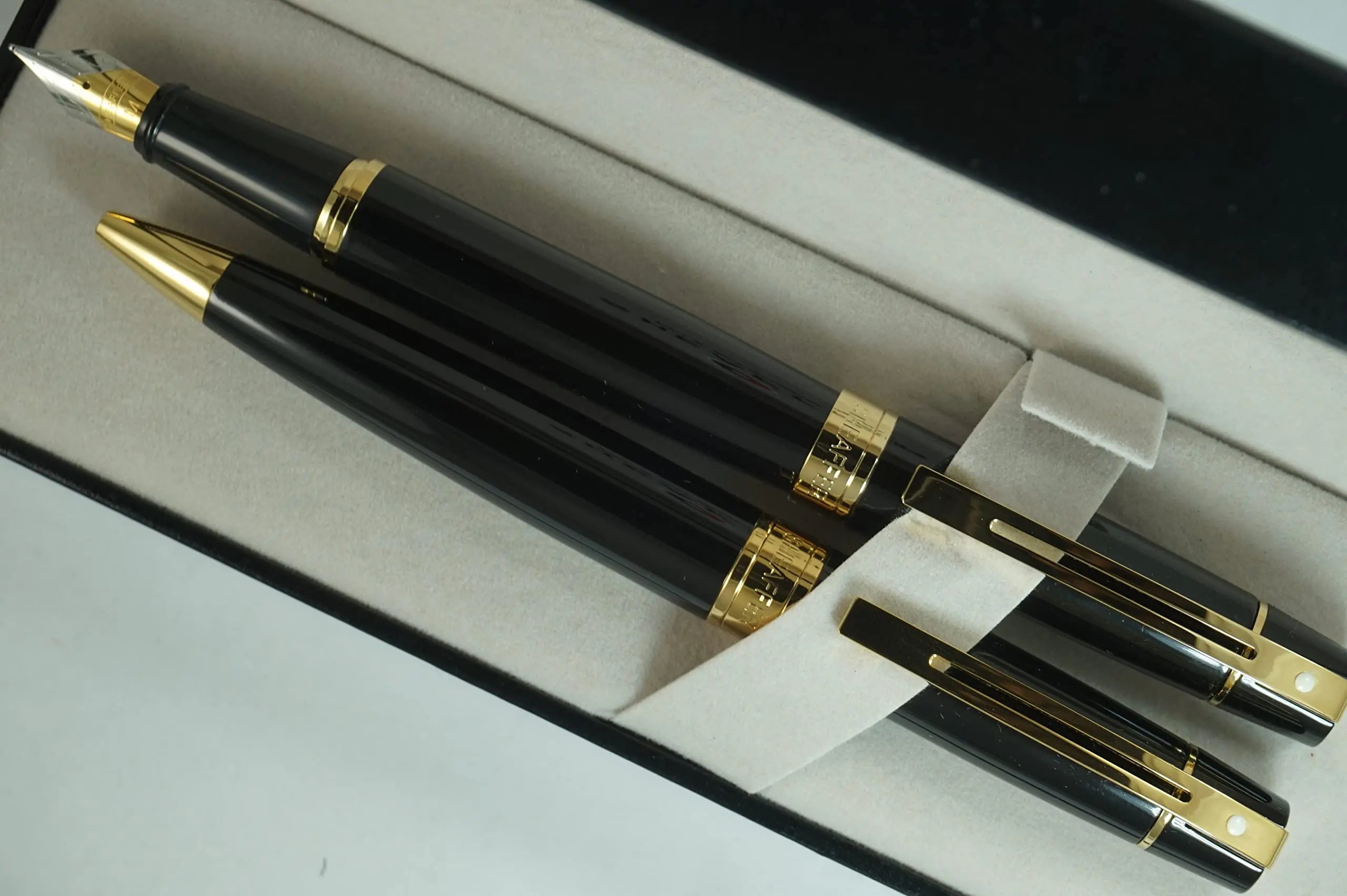 Sheaffer 300 Duo Black Lacquer and Gold Appointments Limited Series with Signature white dot of Excellence and wide band Medium Point Fountain Pen and Ballpoint Pen set. Sheaffer