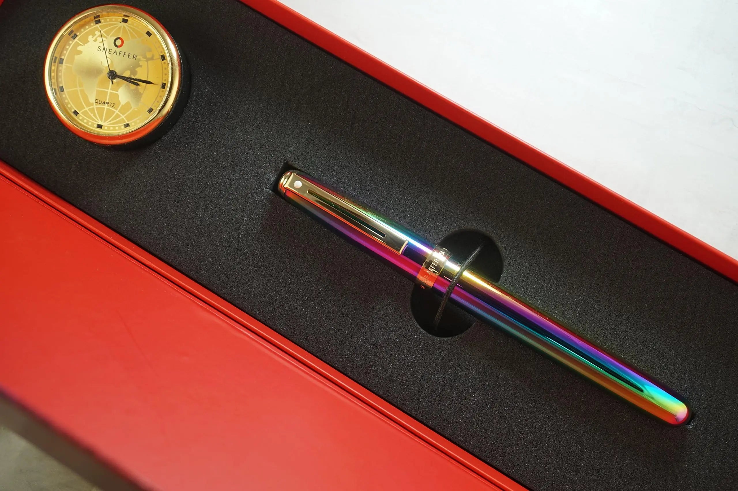 Sheaffer Made in the USA Signature Prelude Titanium oxide Rainbow 'Plasma' finish cap and barrel With 22KT Gold Appointments, Rollerball pen and Matching Gold Desk Clock Sheaffer