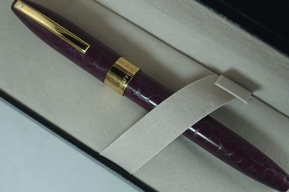 Sheaffer made in the USA Legacy Heritage Look of Leather Burgundy Barrel, 22KT Gold Appointment and Solid 18KT Medium nib Fountain pen. Made in Iowa, USA cross